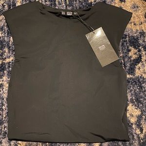 Black body suit with shoulder pad